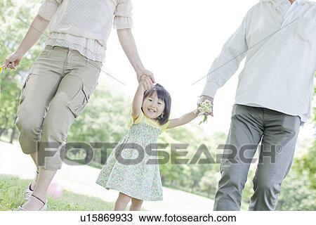 A family holding hands View Large Photo Image Stock Image - A family holding hands. Fotosearch