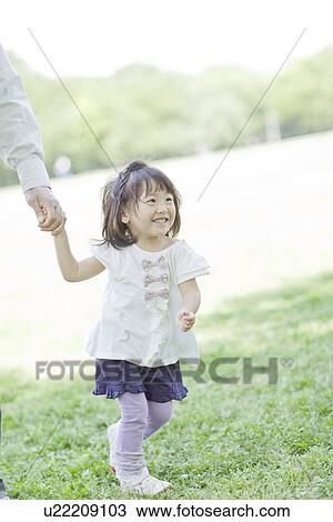 A family holding hands View Large Photo Image Stock Image - A family holding hands. Fotosearch