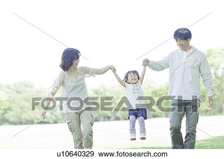 A family holding hands View Large Photo Image Stock Photo - A family holding hands. Fotosearch