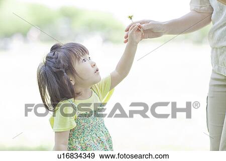 Stock Photo - A girl in the park. Fotosearch