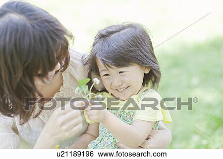 A girl in the park View Large Photo Image Stock Photograph - A girl in the park. Fotosearch
