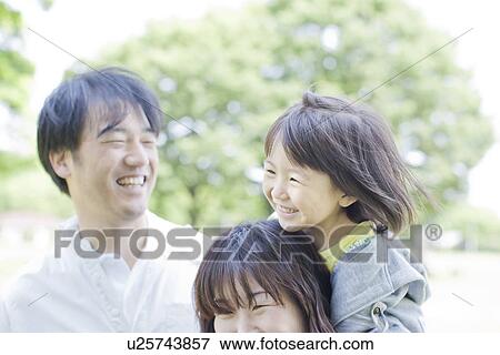 A girl on mother's back View Large Photo Image Stock Photo - A girl on mother's back. Fotosearch