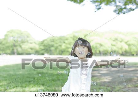 A girl playing bubbles View Large Photo Image Stock Image - A girl playing bubbles. Fotosearch