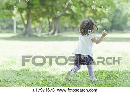 A girl playing bubbles View Large Photo Image Stock Image - A girl playing bubbles. Fotosearch