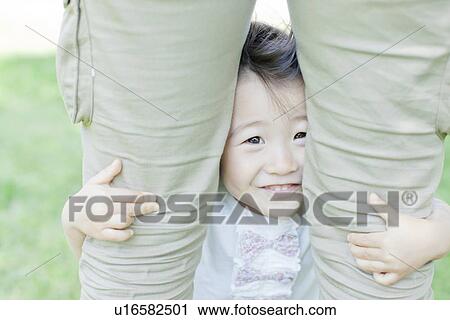 Stock Image - A girl playing with family. Fotosearch