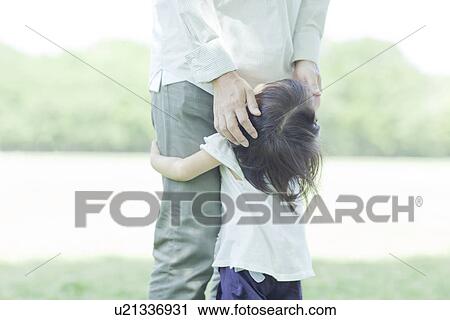A girl playing with family View Large Photo Image Stock Image - A girl playing with family. Fotosearch