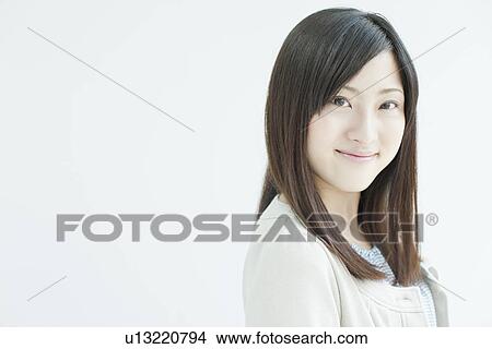 A young woman smiling View Large Photo Image Picture - A young woman smiling. Fotosearch