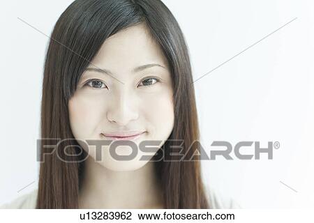A young woman smiling View Large Photo Image Stock Image - A young woman smiling. Fotosearch