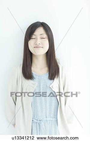 A young woman smiling View Large Photo Image Stock Image - A young woman smiling. Fotosearch