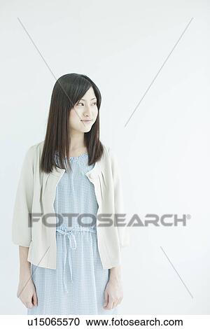 Stock Image - A young woman smiling. Fotosearch
