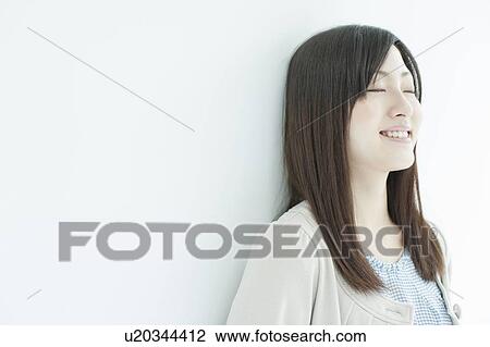 Stock Image - A young woman smiling. Fotosearch