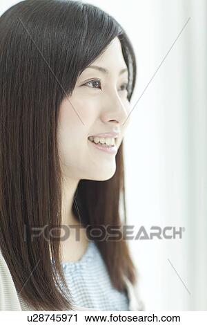 A young woman smiling View Large Photo Image Stock Image - A young woman smiling. Fotosearch