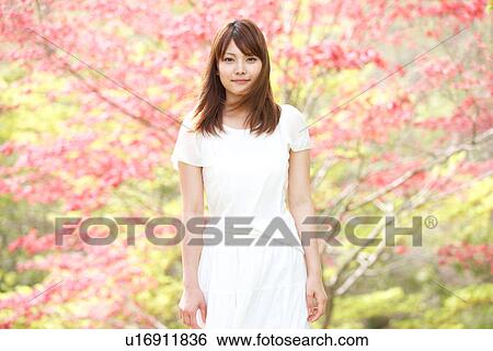 Stock Photograph - A young woman smiling. Fotosearch