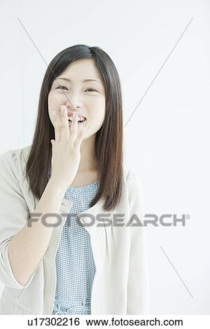 Stock Photograph - A young woman smiling. Fotosearch