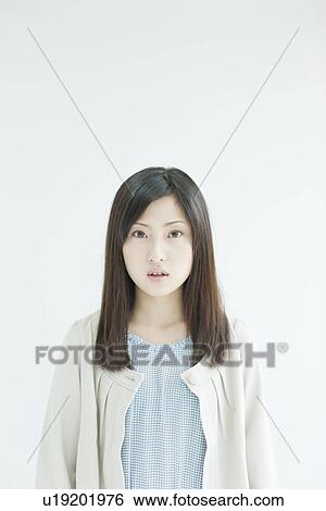 Stock Photograph - A young woman smiling. Fotosearch