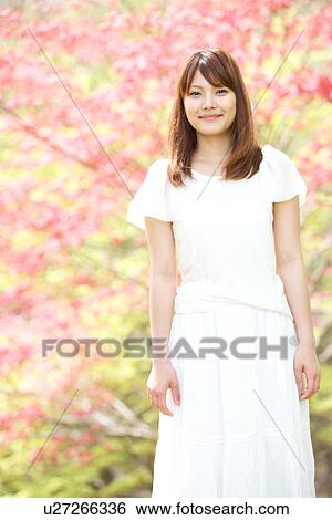 Stock Photograph - A young woman smiling. Fotosearch