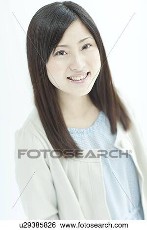 A young woman smiling View Large Photo Image Stock Photograph - A young woman smiling. Fotosearch