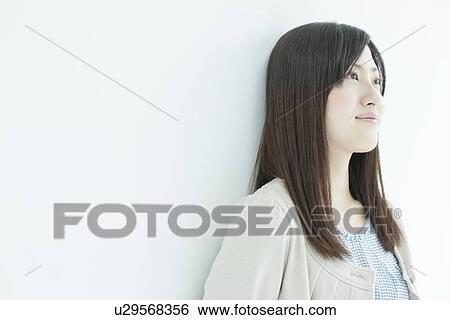 A young woman smiling View Large Photo Image Stock Photograph - A young woman smiling. Fotosearch