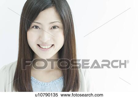 Stock Photography - A young woman smiling. Fotosearch