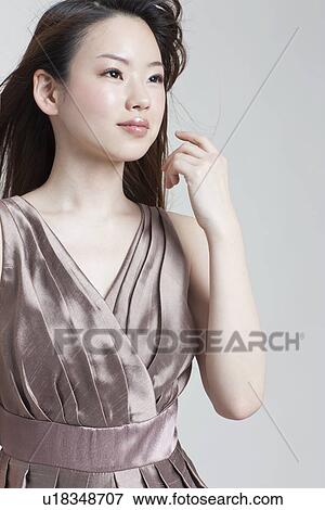 Stock Photo - A young woman. Fotosearch