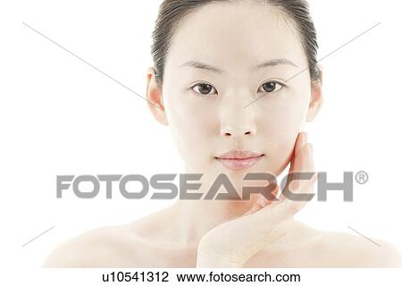 A young woman taking care of face skin View Large Photo Image Stock Image - A young woman taking care of face skin. Fotosearch