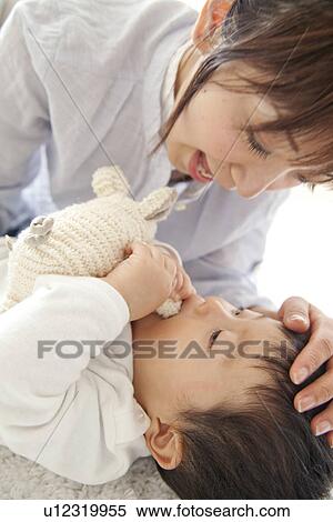 Stock Photography - Baby boy and mother. Fotosearch