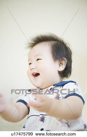 Stock Photo - Baby laughing. Fotosearch
