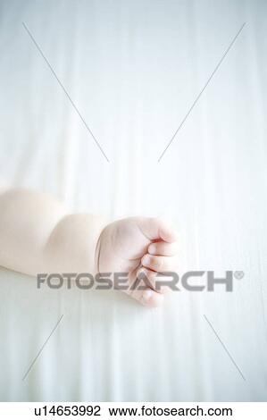 Stock Image - Baby's hand. Fotosearch