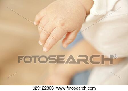 Stock Image - Baby's hand. Fotosearch