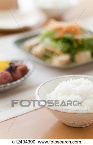 Stock Image - Boiled Rice at Breakfast Table. Fotosearch