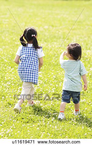 Boy and Girl Walking In Field View Large Photo Image Stock Image - Boy and Girl Walking In Field. Fotosearch