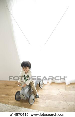 Stock Photography - Boy playing with toy car. Fotosearch