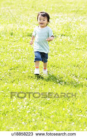Boy Running on Lawn View Large Photo Image Stock Image - Boy Running on Lawn. Fotosearch