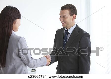 Businessman and Businesswoman Shaking Hands View Large Photo Image Picture - Businessman and Businesswoman Shaking Hands. Fotosearch