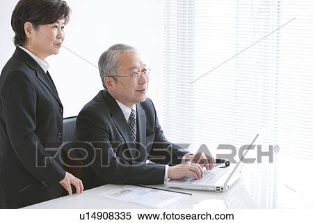 Businessman and Businesswoman View Large Photo Image Stock Photography - Businessman and Businesswoman. Fotosearch