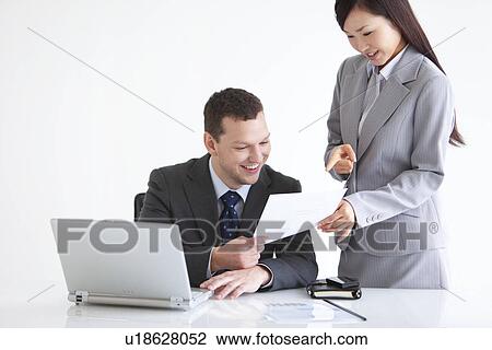 Businessman and Businesswoman Working Together View Large Photo Image Stock Image - Businessman and Businesswoman Working Together. Fotosearch