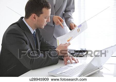 Businessman and Businesswoman Working Together View Large Photo Image Stock Photo - Businessman and Businesswoman Working Together. Fotosearch