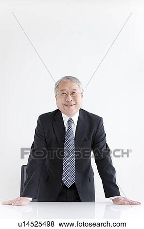 Businessman at Desk Standing View Large Photo Image Stock Photo - Businessman at Desk Standing. Fotosearch