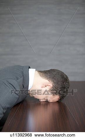 Stock Photo - Businessman at Desk. Fotosearch