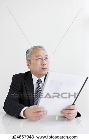 Stock Photo - Businessman at Desk. Fotosearch