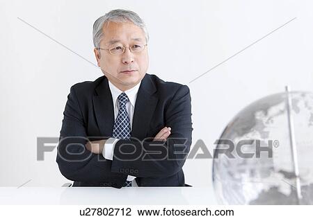 Businessman Looking at Globe View Large Photo Image Stock Image - Businessman Looking at Globe. Fotosearch