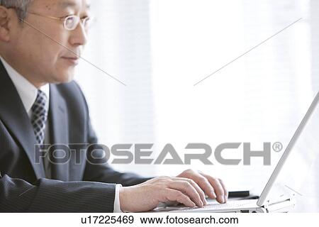 Businessman Typing on Laptop View Large Photo Image Stock Photo - Businessman Typing on Laptop. Fotosearch