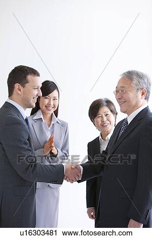 Businessmen and Women In a Meeting View Large Photo Image Stock Image - Businessmen and Women In a Meeting. Fotosearch