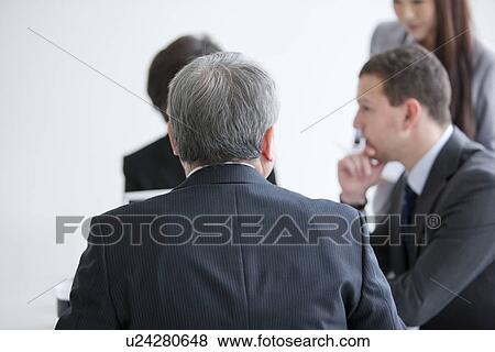 Businessmen and Women In a Meeting View Large Photo Image Stock Photo - Businessmen and Women In a Meeting. Fotosearch