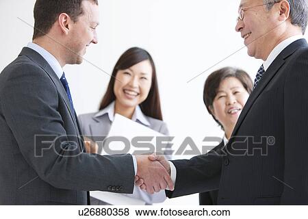 Businessmen and Women In a Meeting View Large Photo Image Stock Photo - Businessmen and Women In a Meeting. Fotosearch