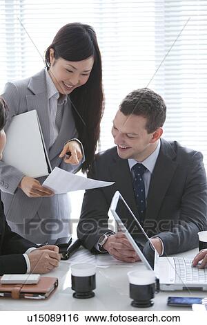 Businessmen and Women In a Meeting View Large Photo Image Stock Photograph - Businessmen and Women In a Meeting. Fotosearch