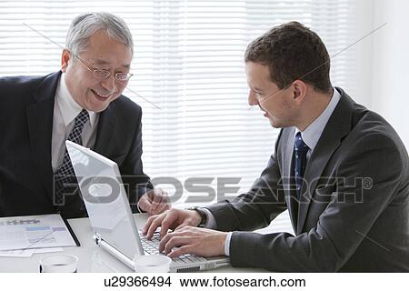 Businessmen In a Meeting View Large Photo Image Picture - Businessmen In a Meeting. Fotosearch