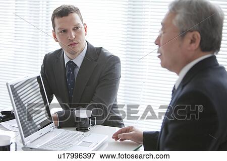 Businessmen In a Meeting View Large Photo Image Stock Photo - Businessmen In a Meeting. Fotosearch