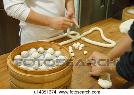 Chefs making Chinese dumplings, Taiwan View Large Photo Image Picture - Chefs making Chinese dumplings, Taiwan. Fotosearch