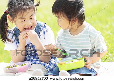 Stock Image - Children Having Lunch. Fotosearch